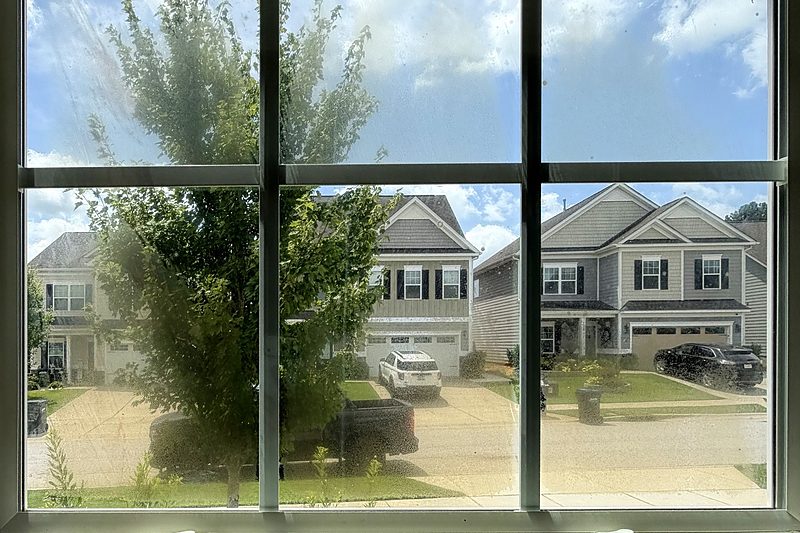 Before: Foggy glass with grids, seen from inside, Indian Land, SC