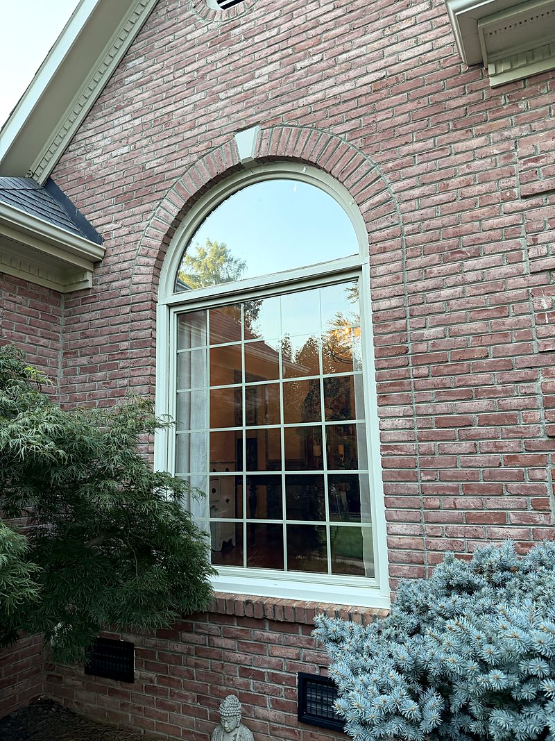 Outside: The same arched window from outside, in the brick wall, Mount Holly, NC